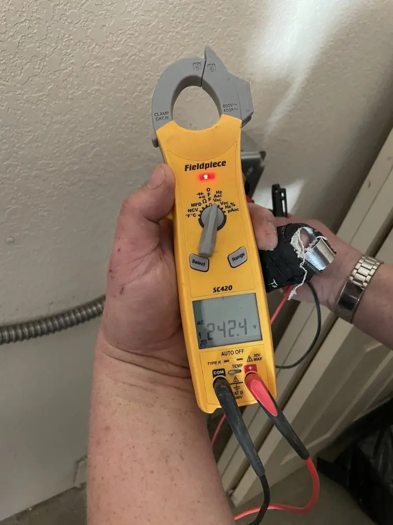 Voltage testing with clamp meter during Outlet Installation in La Verkin